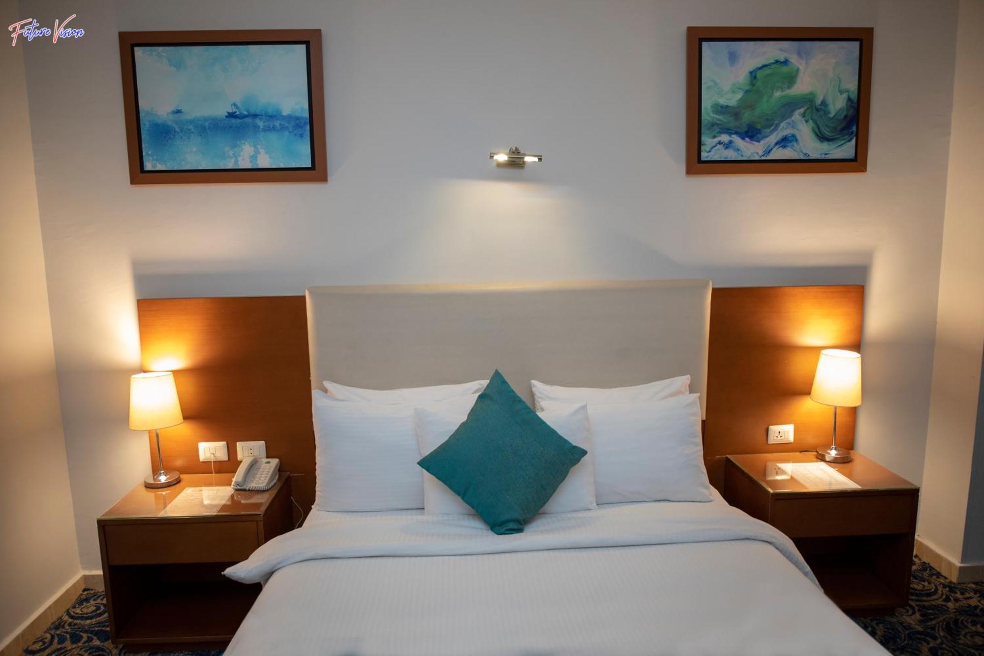 Rehana Plaza Hotel Caïro Buitenkant foto A bedroom at the hotel